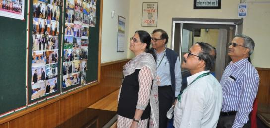 Dr Hina Gokhale, former DG (HR) having a glance of photographs during the meeting