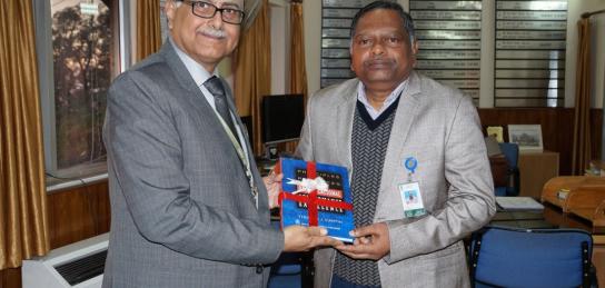 Shri Sanjay Tandon, OS & Director ITM honuring Shri KS Varaprasad, OS & DG (HR) with a book